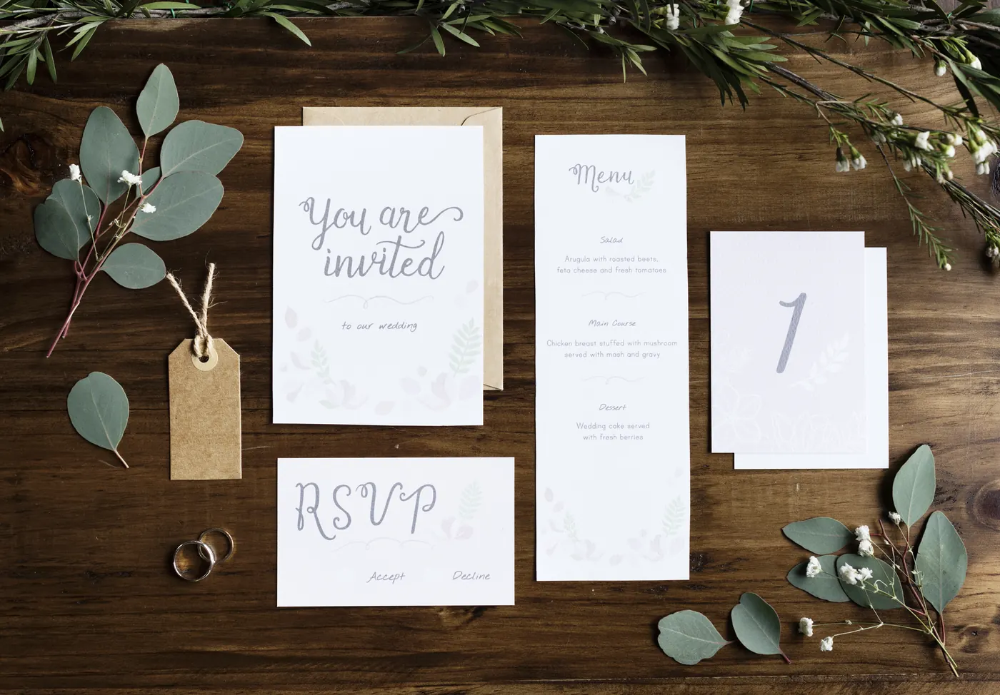 Printed RSVP cards still earn their place next to an online reply link